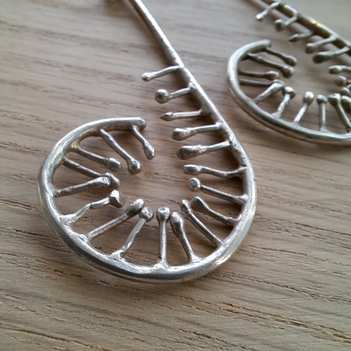 Anthea Peters - Silver unfurling fern earrings