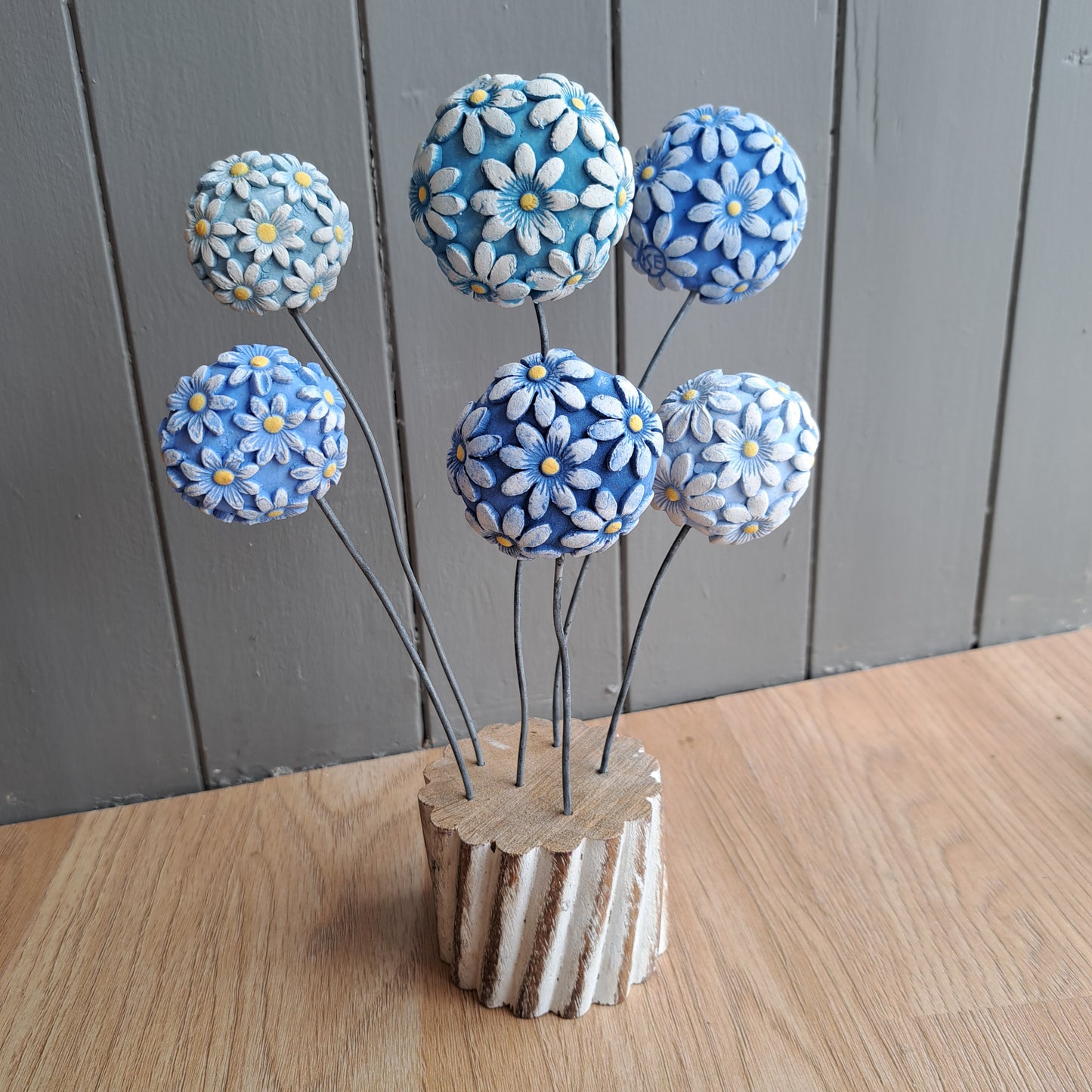 Kate Ellis - Ceramic flowers on wooden base
