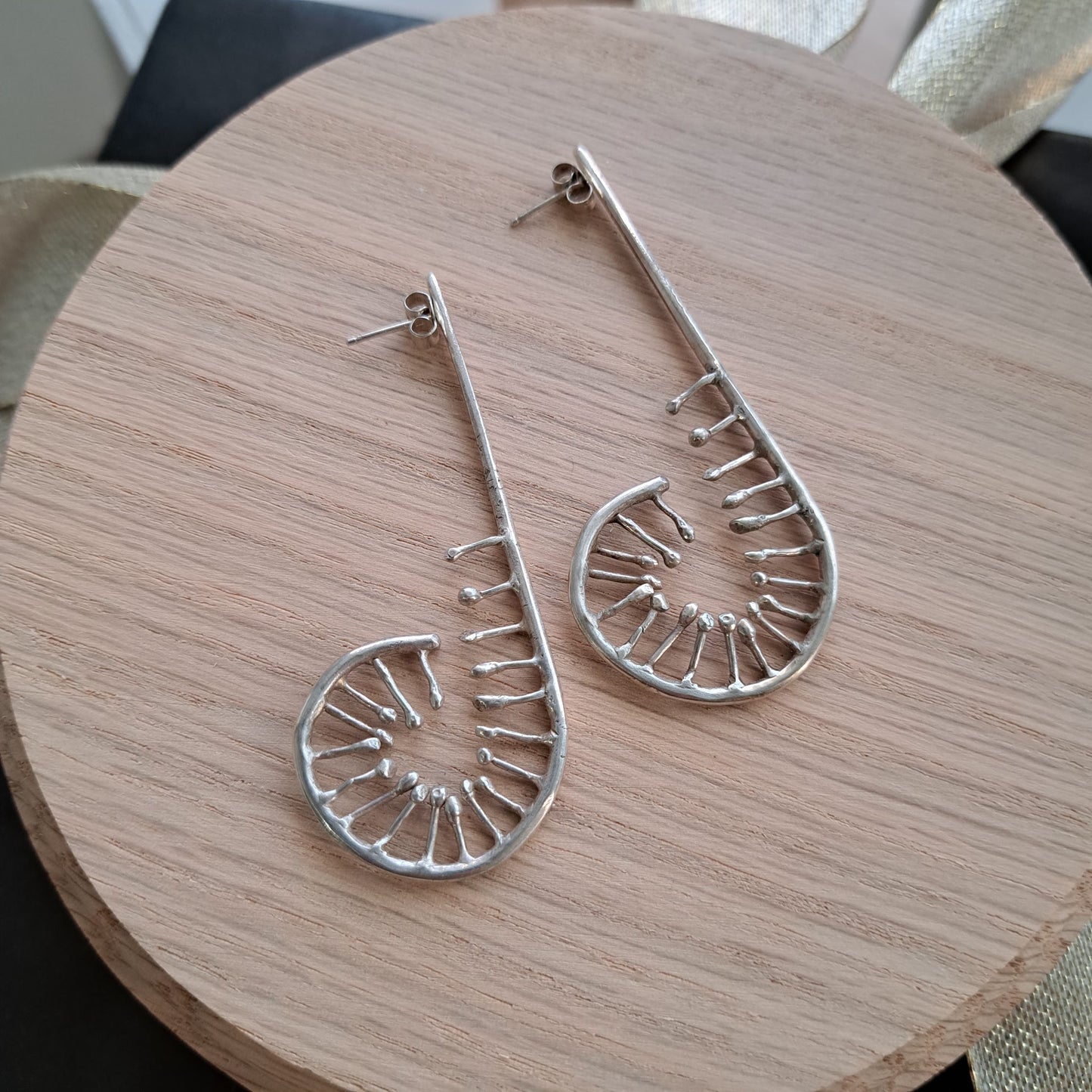 Anthea Peters - Silver unfurling fern earrings