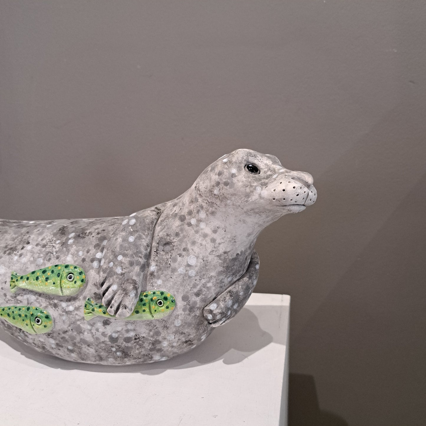 Kate Ellis - Large Grey seal with Green shoal of fish