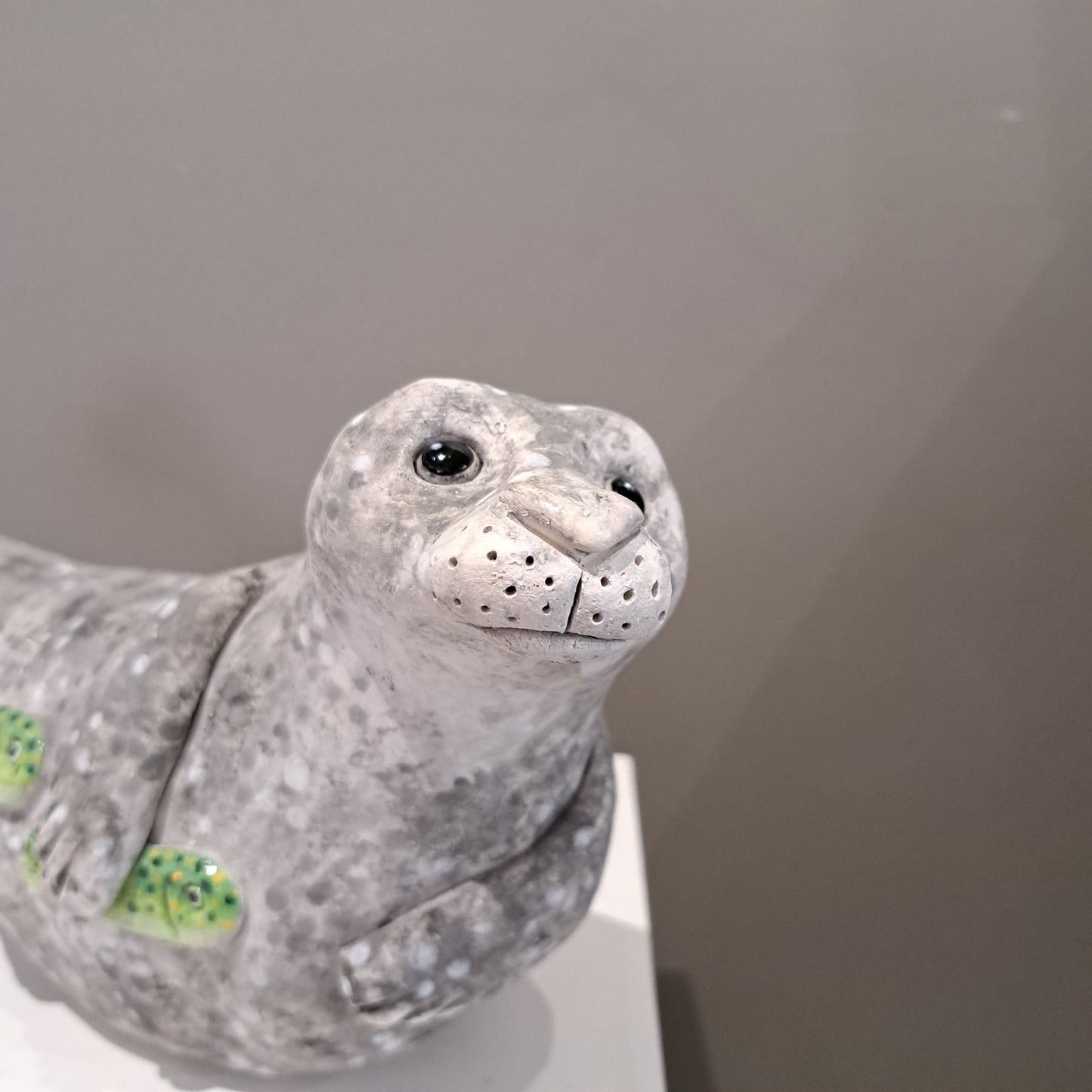 Kate Ellis - Large Grey seal with Green shoal of fish