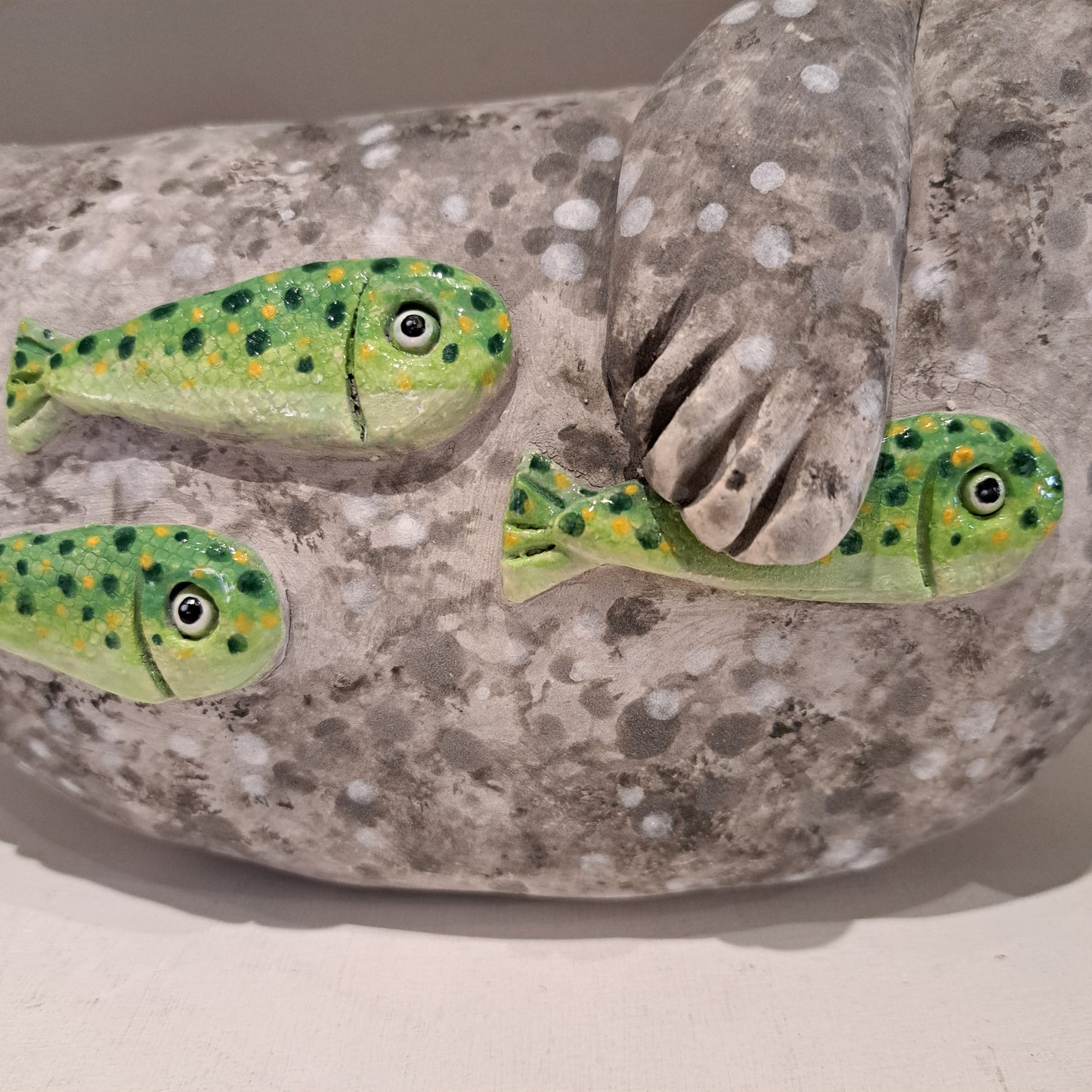 Kate Ellis - Large Grey seal with Green shoal of fish