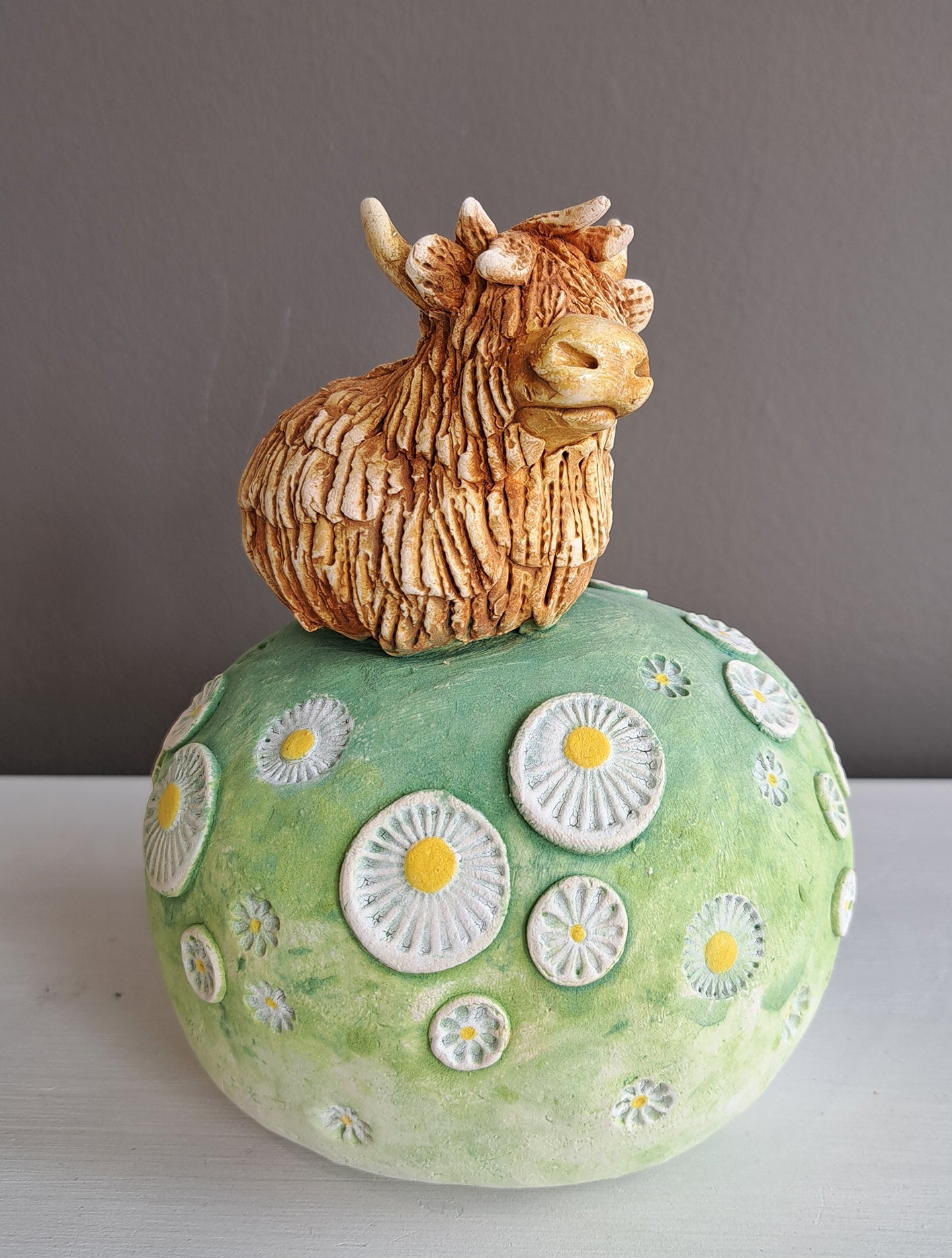 Kate Ellis - Highland Cow on Hill