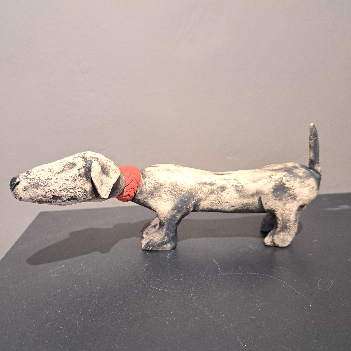 Christine Hughes Sculptures - Daschund with red collar